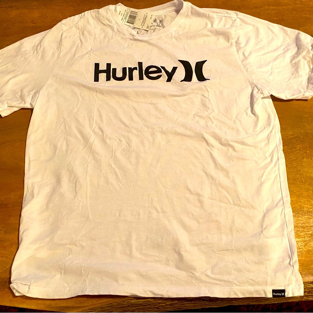 This shirt is new (never worn - wrong size) with original tag.